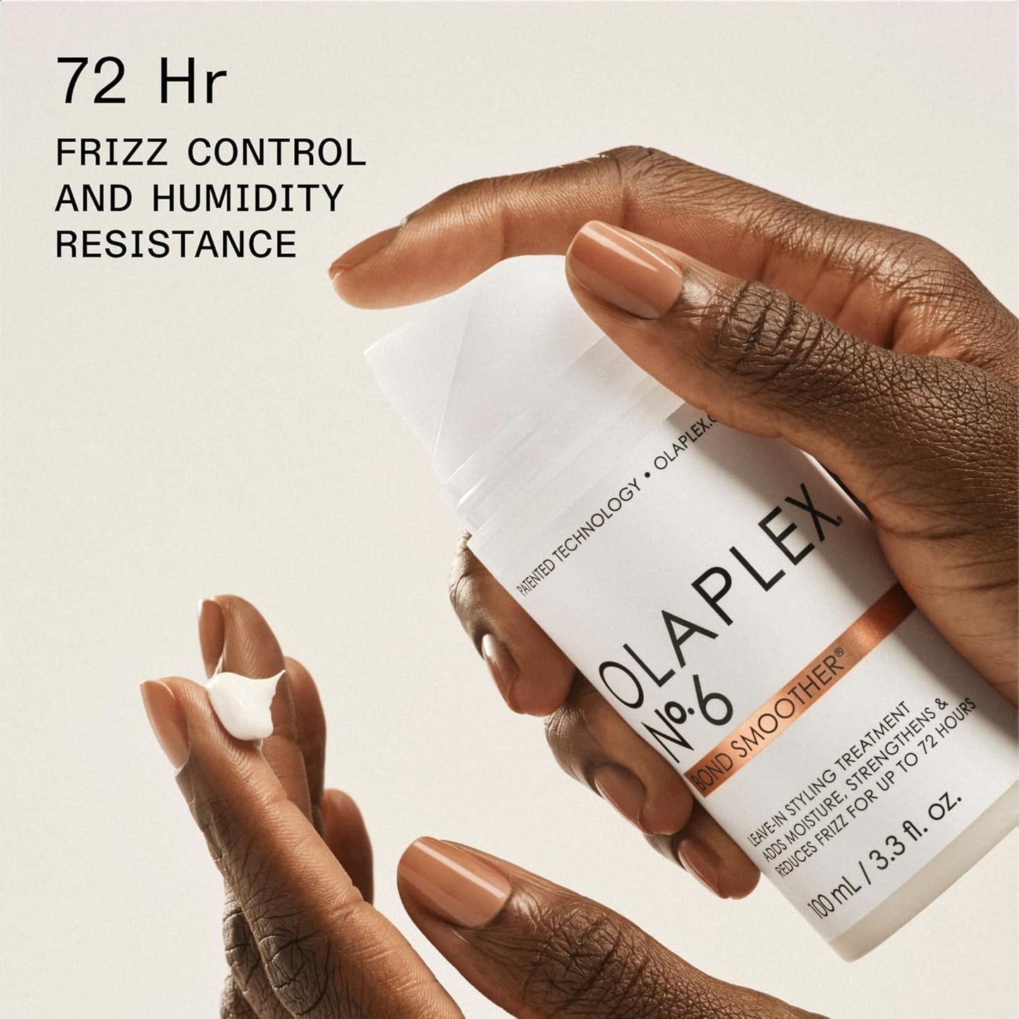 Hand dispensing Olaplex No. 6 Bond Smoother showing lightweight leave‑in cream texture