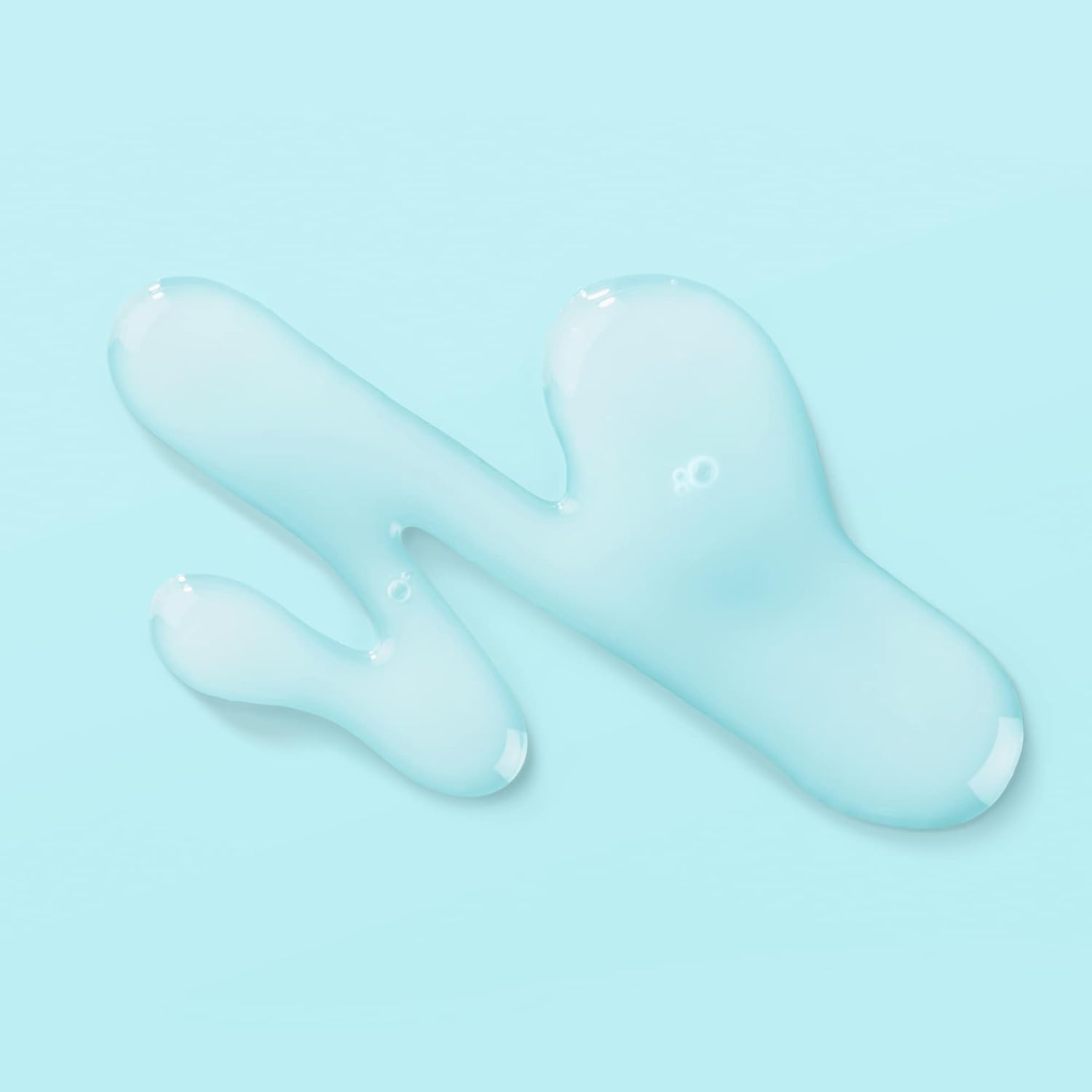 Blue liquid droplets on a light blue background