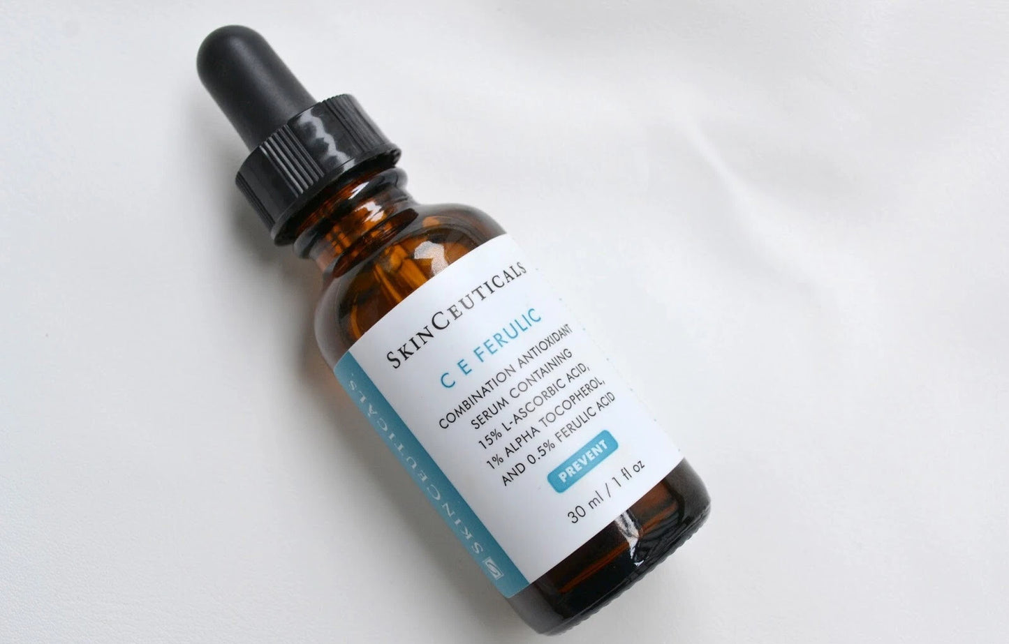 SkinCeuticals CE Ferulic bottle with dropper on a light background