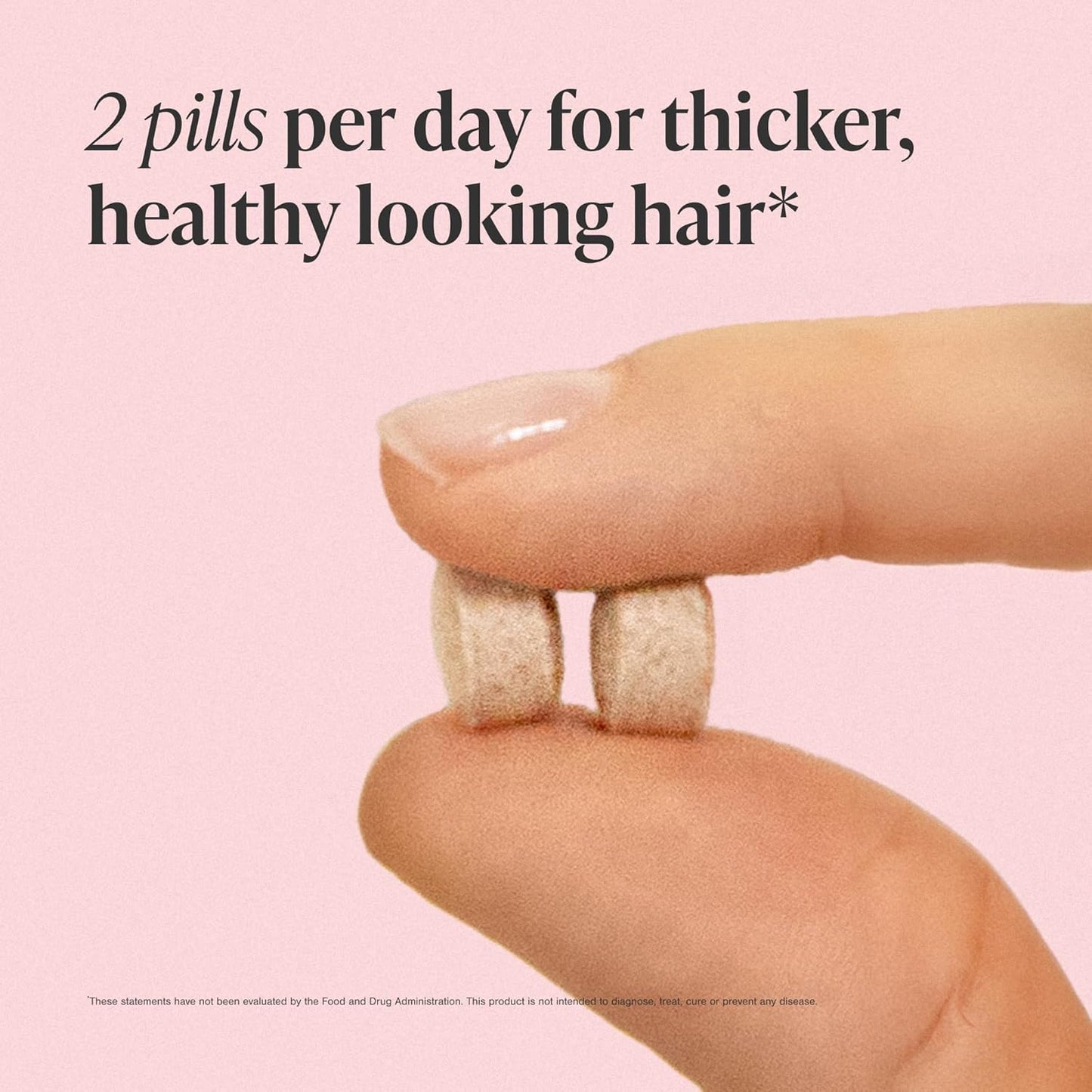 Two pills held between fingers with text on a pink background