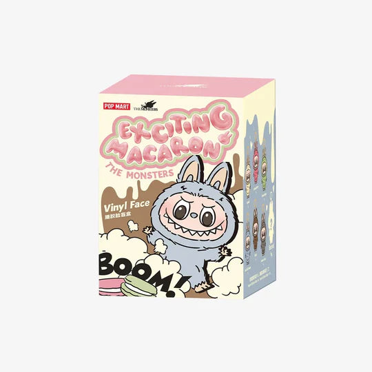 Box of 'Exciting Macaron' vinyl face toy with cartoon character on a white background