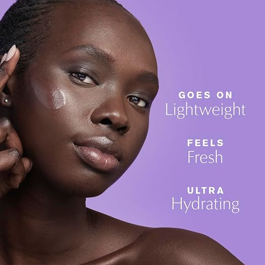 Model applying Estée Lauder Perfectionist Pro Rapid Brightening Treatment to cheek