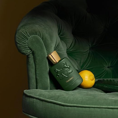 Green bottle with wooden cap on a green cushioned surface