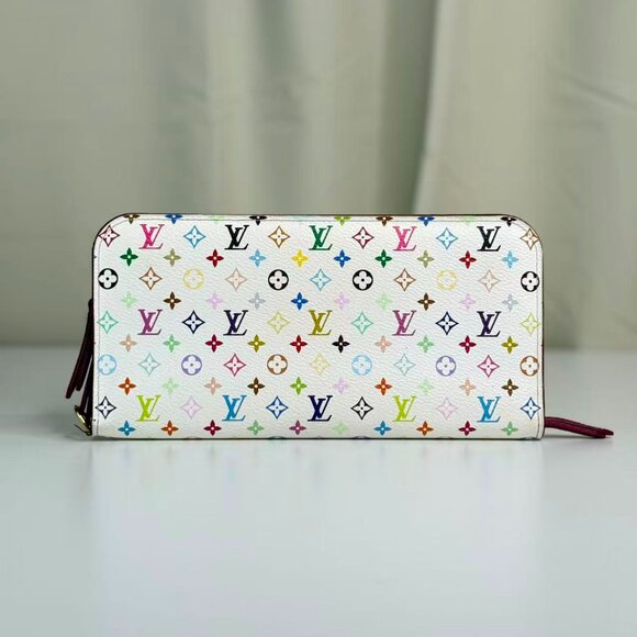 Multicolored patterned wallet on a light surface with a neutral background