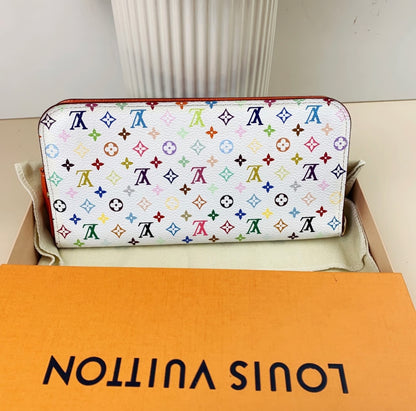 Louis Vuitton wallet with multicolor monogram pattern on a branded box.