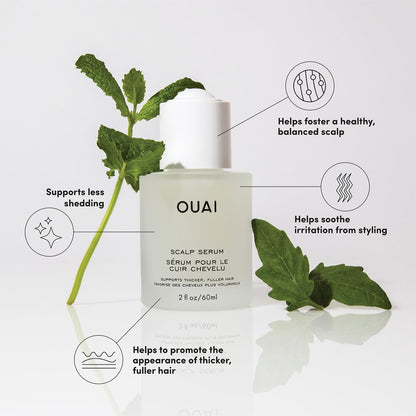 OUAI scalp serum bottle with green leaves on a white background