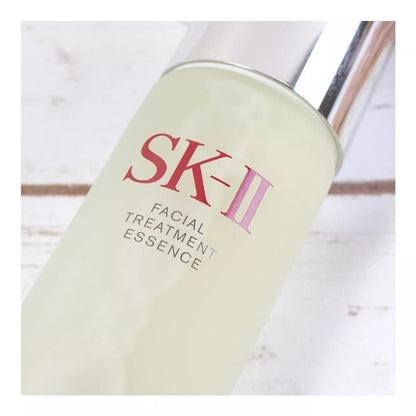 SK-II Facial Treatment Essence bottle on a light wooden surface