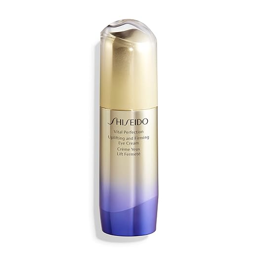 Close‑up of Shiseido Vital Perfection Eye Cream bottle on light background