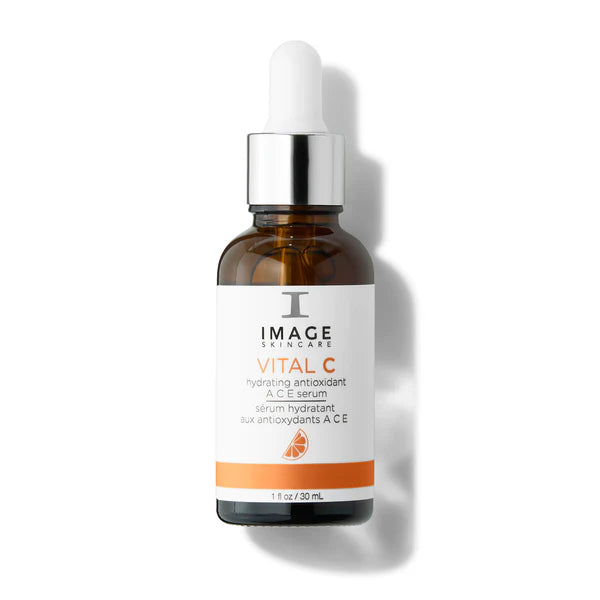 Skincare serum bottle with dropper labeled 'IMAGE Skincare Vital C' on a white background