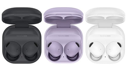 Three pairs of wireless earbuds in open cases on a white background