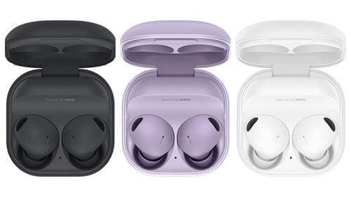 Three pairs of wireless earbuds in open cases on a white background