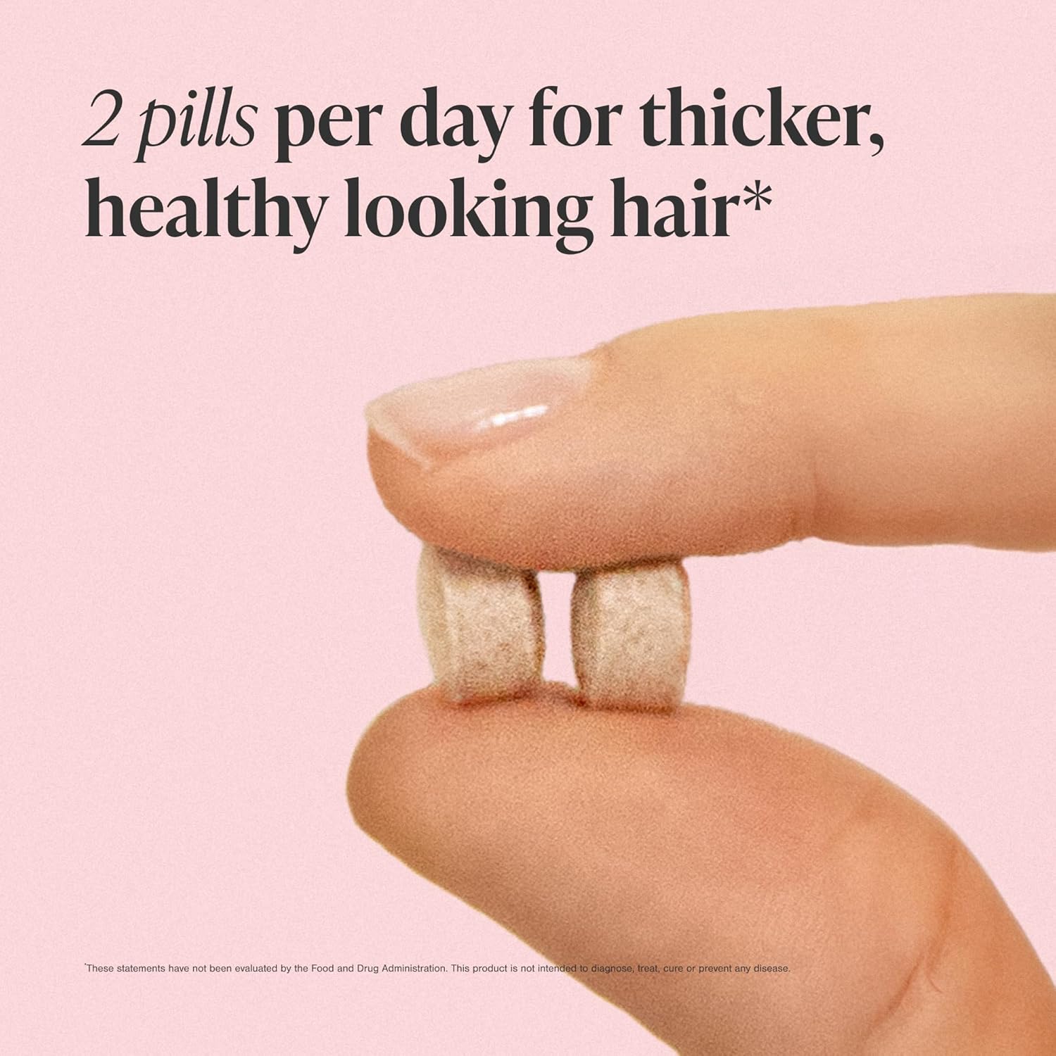 Two pills held between fingers with text on a pink background